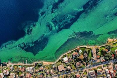 Adaptive Neuro-Symbolic Planning for Coastal Climate Resilience with Embedded Agent Feedback Loops