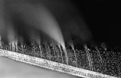 Improving Vortex-Induced Vibration Mitigation in Floating Wind Turbines through Adaptive Flow Control Inspired by Biology